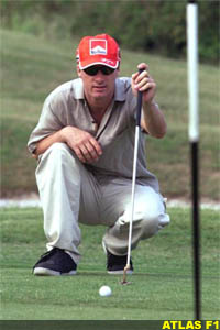 Eddie Irvine plays golf