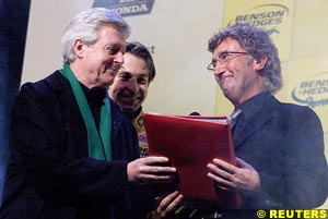 Aspel presents Eddie Jordan with the Big Red Book